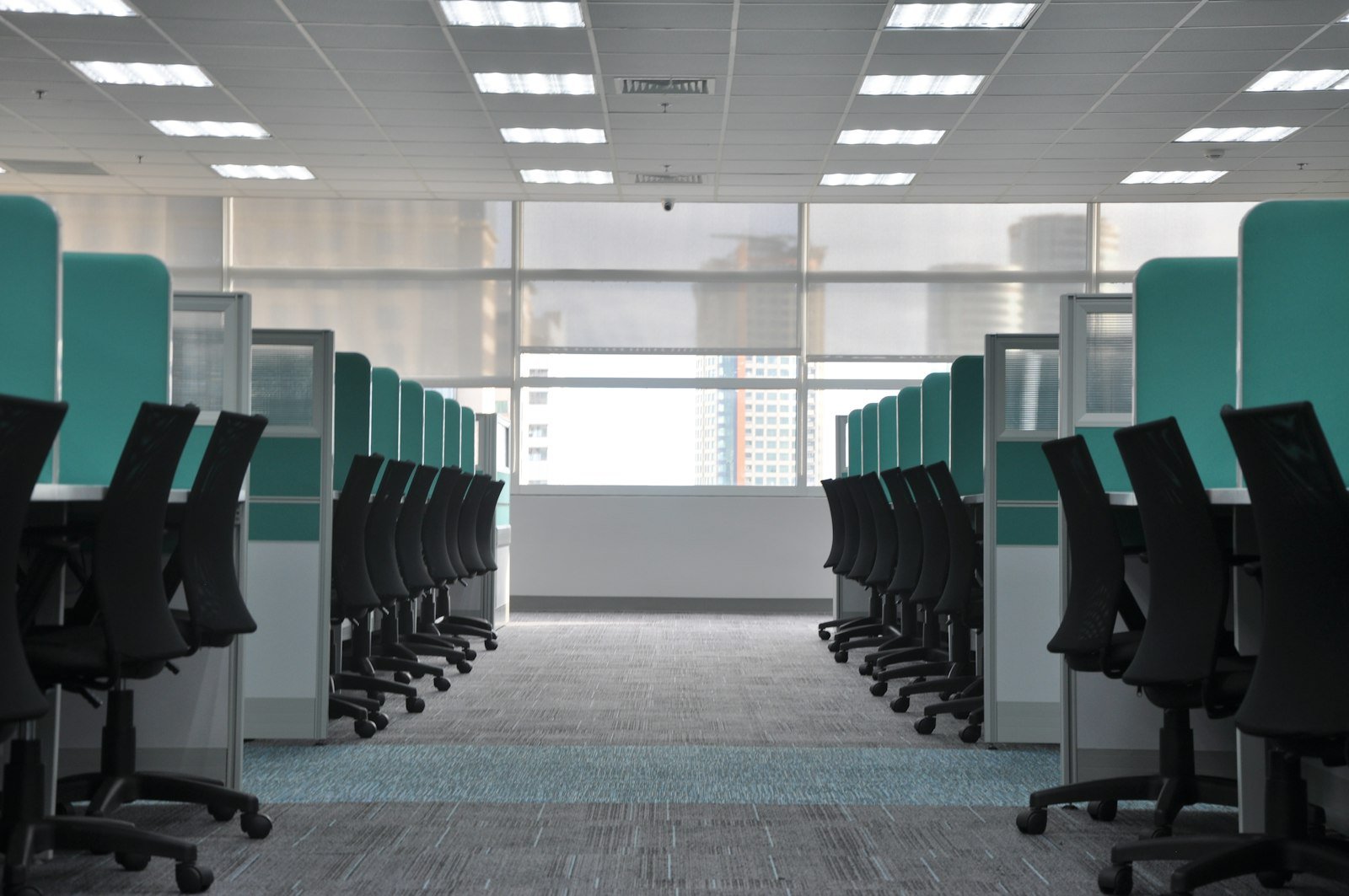 Office desks and chairs being cleared for an office relocation